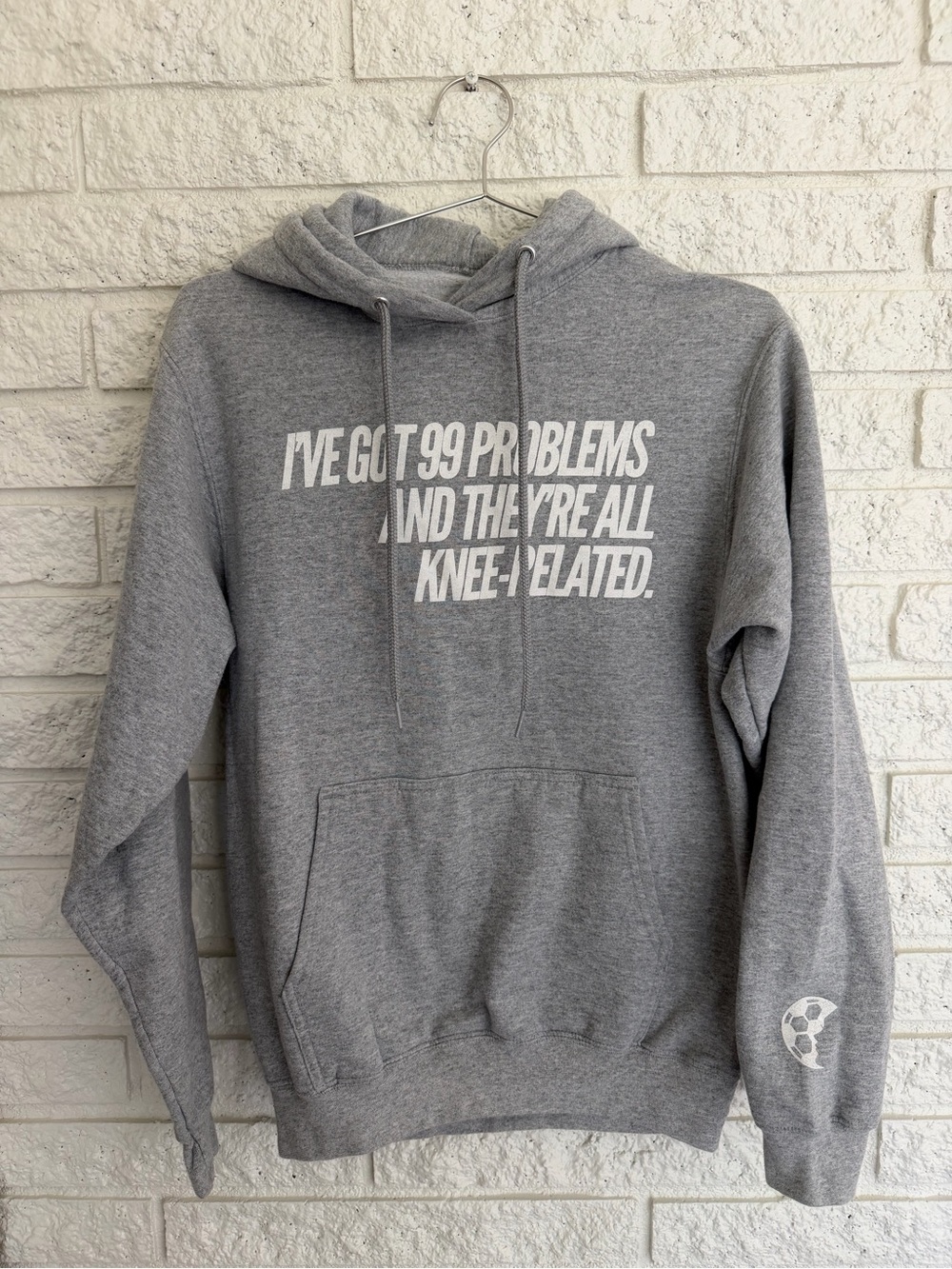 Soccergrl Problems Gray Graphic Pullover Hoodie with Knee-Related text